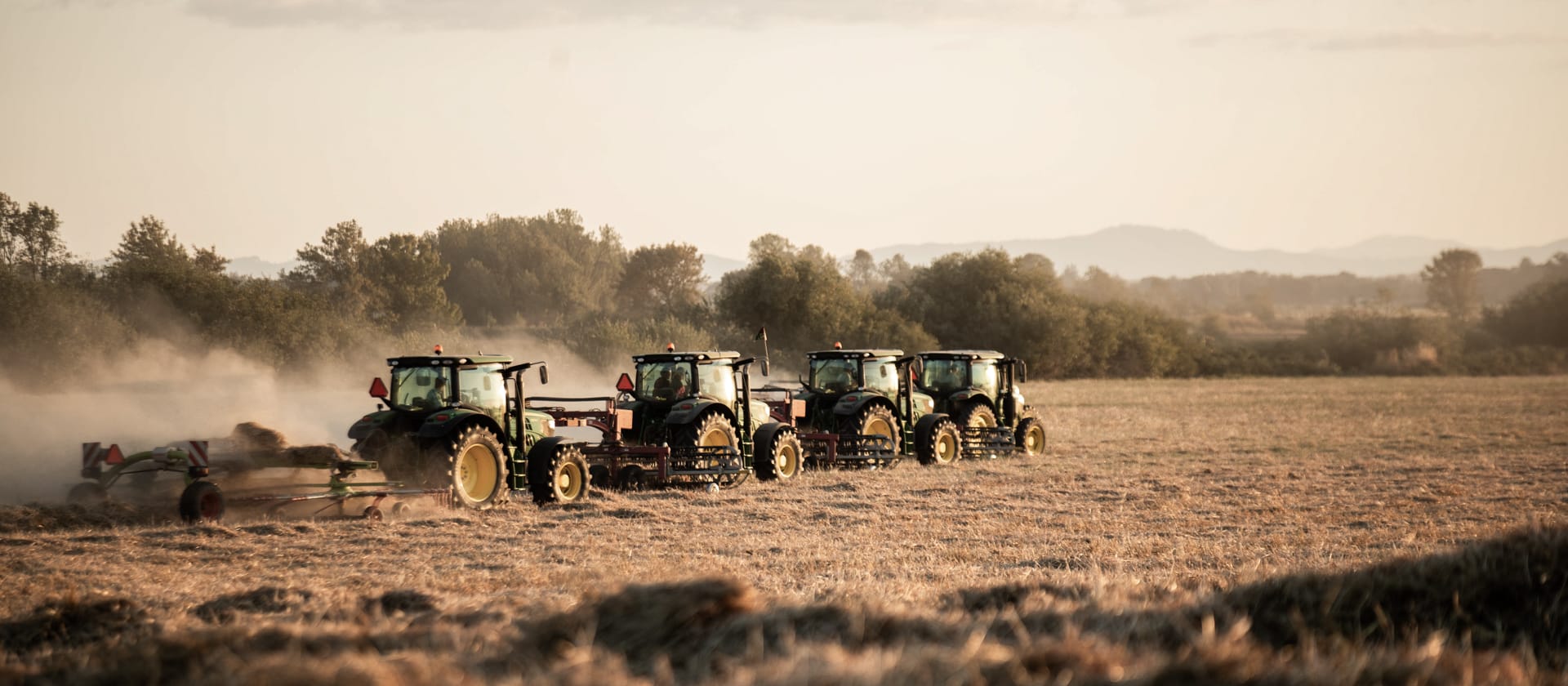 tractors in hay field for about us page